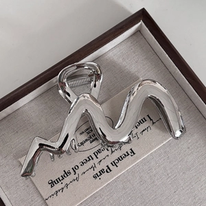 Minimalist silver metal wave hair claw clip with polished finish for women