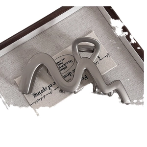 Minimalist silver metal wavy hair claw clip with large shark jaw design for women