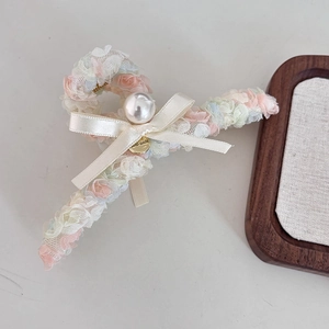 Floral mesh hair claw with large pearls and beige satin bow for elegant styling