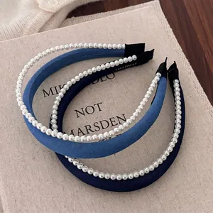 Elegant blue denim headbands with white pearl embellishments and handmade label