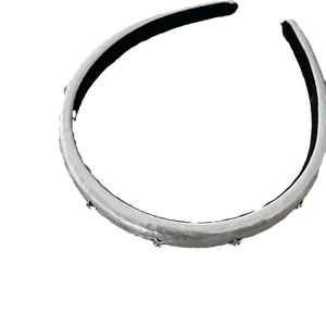 Silver metallic star headband with padded fabric and minimalist luxury style for women