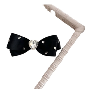 Elegant black satin bow hair clip featuring a sparkling heart rhinestone and flower accents