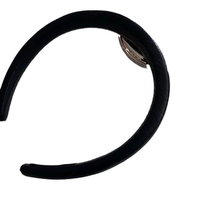 Minimalist black leather headband with textured cross-grain finish and silver metal buckle