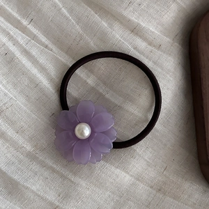 Elegant purple acetate flower hair scrunchie with pearl center on elastic band