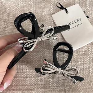 Pinces à cheveux nœud papillon en métal noir et argent pour coiffures élégantes