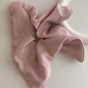 Elegant large pink satin hair scrunchie with silky luster for high ponytail styling