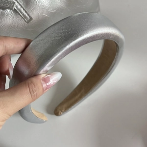 Silver metallic wide headband with padded sponge design and a smooth glossy finish