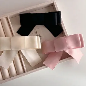 Set of large French satin bow hair clips in black, cream white and soft pink