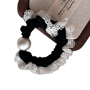 Elegant black silk scrunchie with white lace trim and a large white pearl detail