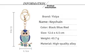Detail view of owl keychain featuring blue rhinestones and gold alloy with size specs