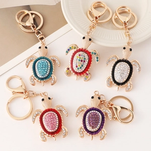 Cinq porte-clés tortue dorée avec strass brillants et carapaces en émail coloré