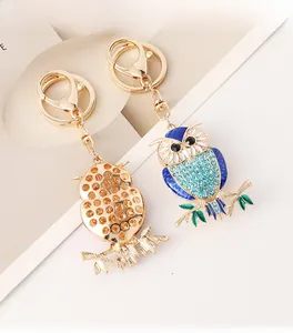 Detailed front and back view of blue owl keychain with crystal inlay and lobster clasp