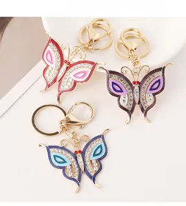 Close-up of butterfly keychains featuring colorful enamel and sparkling rhinestones