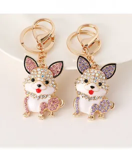 Detailed macro view of cute Corgi keychain pendants with pink and purple rhinestones