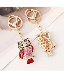 Detailed front and back view of owl keychain with pink rhinestones and gold lobster clasp