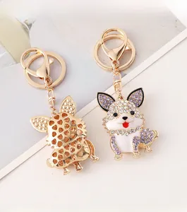Detailed front and back views of a sparkling crystal encrusted puppy dog keychain
