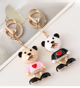 Detail of pink and white bear keychains with enamel heart and sparkling rhinestones