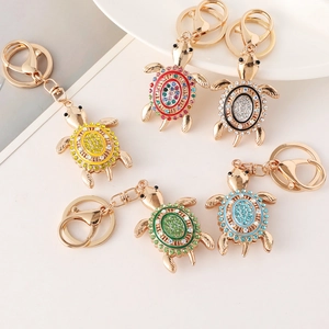 Colorful turtle rhinestone keychains in five vibrant colors with golden metal plating