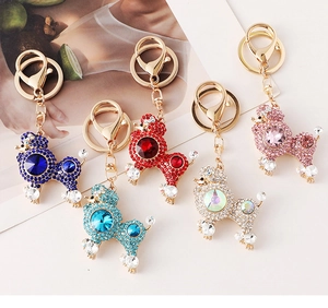 Five colorful rhinestone poodle keychains with gold-tone lobster clasps for bags