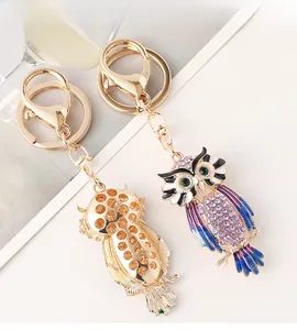 Detail of colorful crystal owl keychain showing crystal pavé and gold hollow back