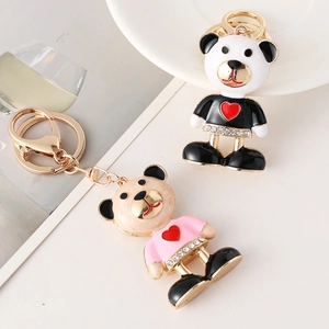 Creative bear keychain with heart and rhinestones in black and pink enamel finish