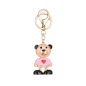 Creative bear keychain with gold plating, heart detail, and rhinestones on white background