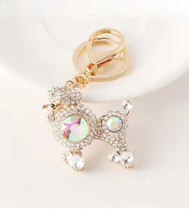 Macro shot of gold poodle keychain featuring sparkling rhinestones and crystal details
