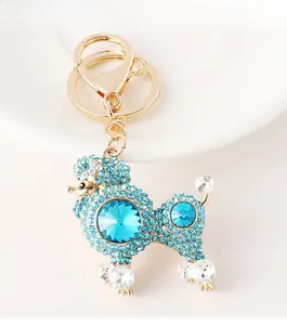 Detail of crystal poodle keychain with blue rhinestones and gold lobster clasp