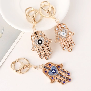 Lot de trois porte-clés Main de Fatma et Œil de Turquie avec strass en forme de cœur