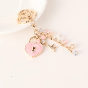 Exquisite golden heart lock keychain with pink crystals and rhinestones for handbags