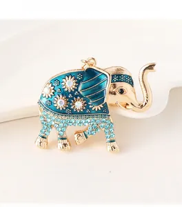 Detail of crystal elephant keychain with blue enamel and sparkling floral rhinestone pattern