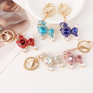 Poodle keychain pendants with sparkling crystals and golden rings in five vibrant colors
