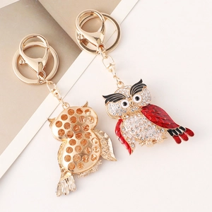 Porte-clés chouette créatif avec strass brillants et ailes en émail rouge doré