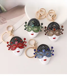Detailed macro view of Venetian mask keychains with colorful rhinestones in four styles
