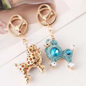 Chic rhinestone poodle keychains in gold hollow dots and sparkling blue gemstone styles