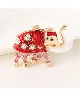 Macro shot of colorful elephant keychain with red enamel and sparkling crystals