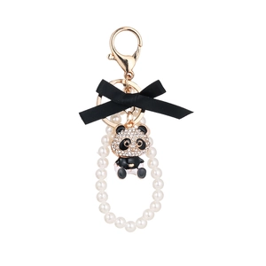 Cute panda pendant keychain with sparkling rhinestones, white pearls, and black bow ribbon