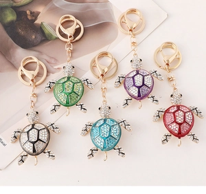 Detailed view of colorful sea turtle keychains with crystal rhinestones in five vibrant colors