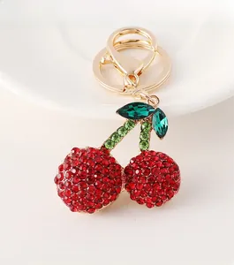 Detailed close-up of cherry keychain featuring sparkling red and green rhinestones