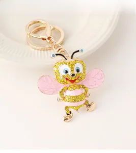 Detail of creative bee keychain with gold alloy finish and sparkling yellow rhinestones