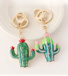 Detailed macro view of rhinestone cactus keychains with colorful crystals and enamel finish
