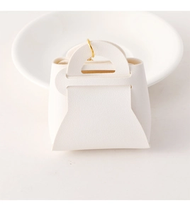 Detailed close-up of a white mini handbag gift box with premium litchi leather texture