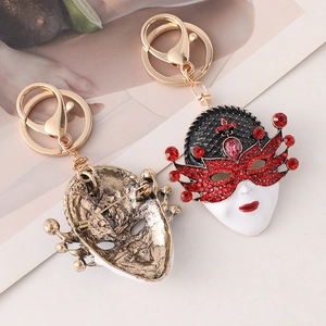 Exquisite Venetian mask keychain with red diamonds and vintage bronze finish design