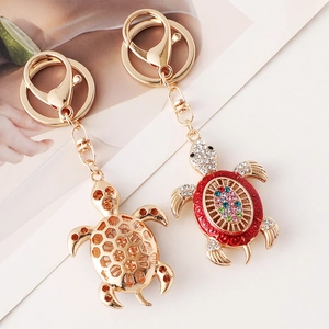 Kreative Schildkröten-Schlüsselanhänger mit bunten Kristallen und goldenem Design