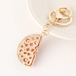 Golden creative keychain with star and moon hollowed-out semicircle fruit design