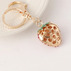 Porte-clés fraise étincelant avec strass et fermoir homard sur métal or rose