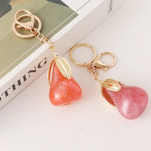 Porte-clés créatifs en forme de poire en résine pailletée dorée, orange et rose-violet