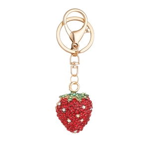 Porte-clés fraise doré orné de strass rouges et verts avec un fermoir mousqueton