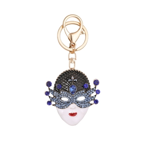 Exquisite Venetian mask keychain in gold alloy with blue rhinestones and white enamel finish
