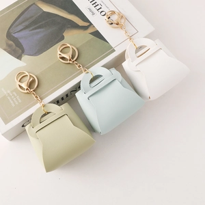 Mini leather purse keychain in green, blue, and white with golden lobster clasp and chain